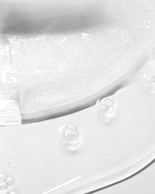 Textural view of bubbling and smooth serum formula from the hydrating sheet mask.